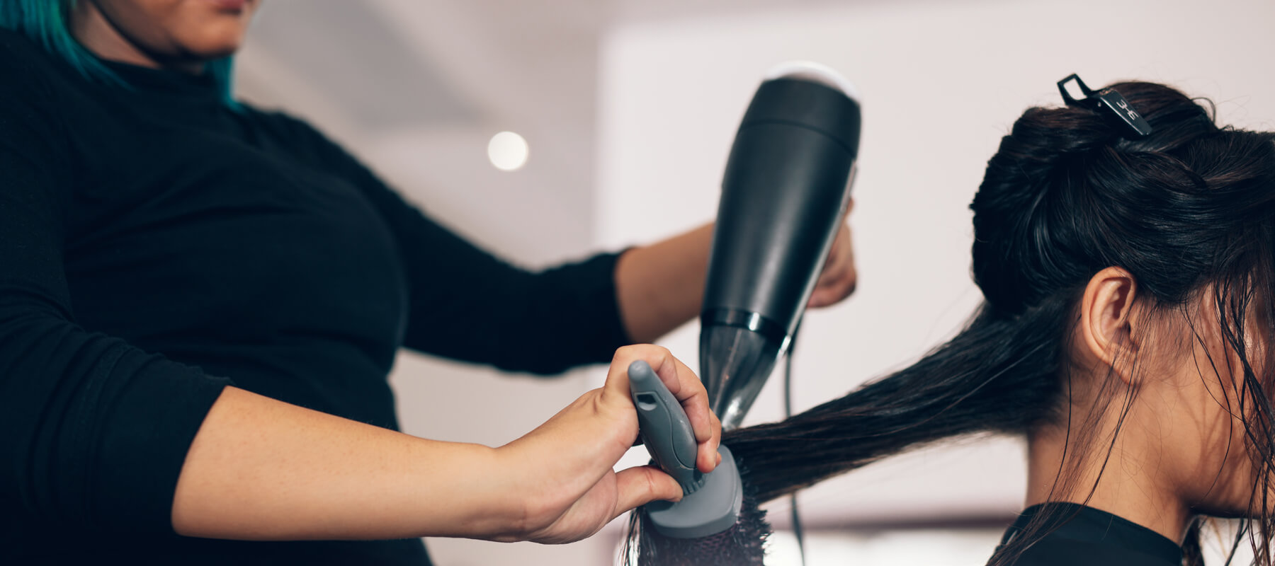 Blow drying hair at Styling Station